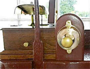 Bell plunger and bell in Withyham Gate Box at Sheffield Park, part of the Bluebell Railway Museum.